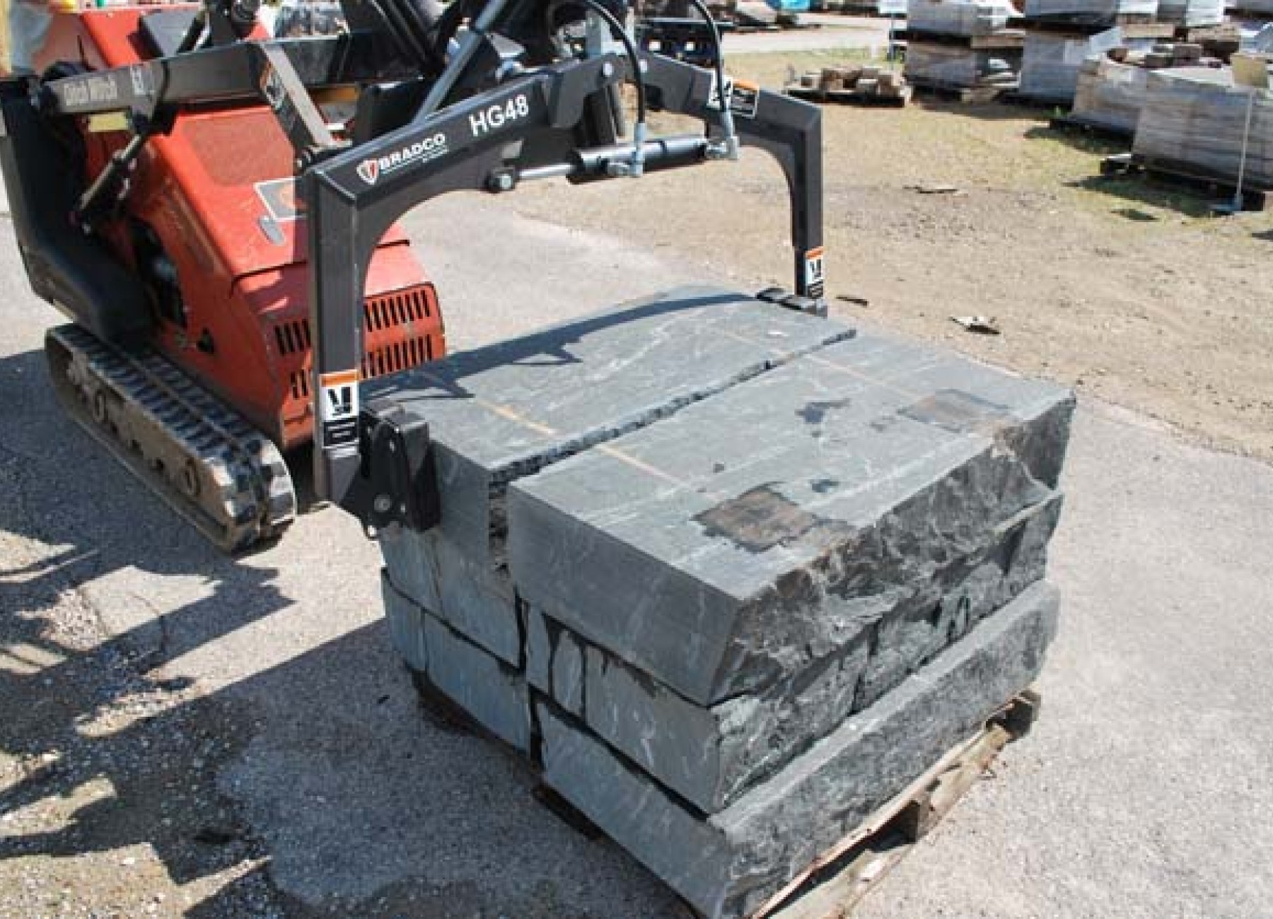 Rent the Hardscape Grapple Attachment for Mini Skid Steer AC&E Rentals